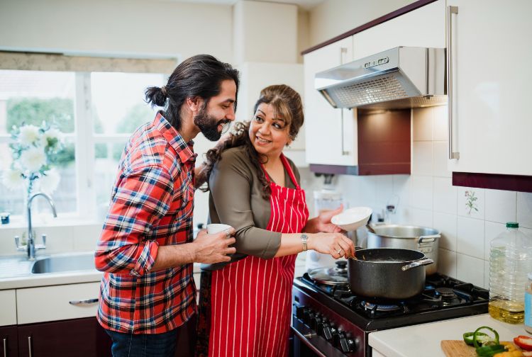 Mother and son in kitchen during the holidays