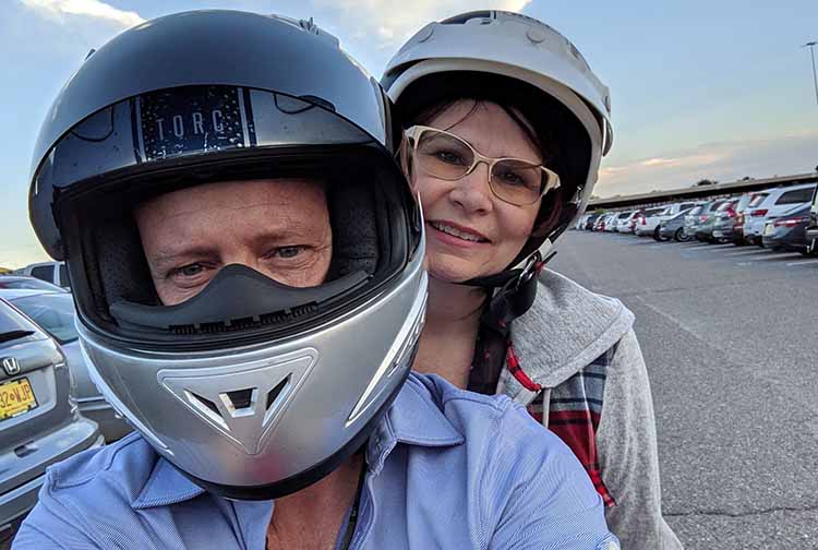 Julie Graham seated on a motorcycle