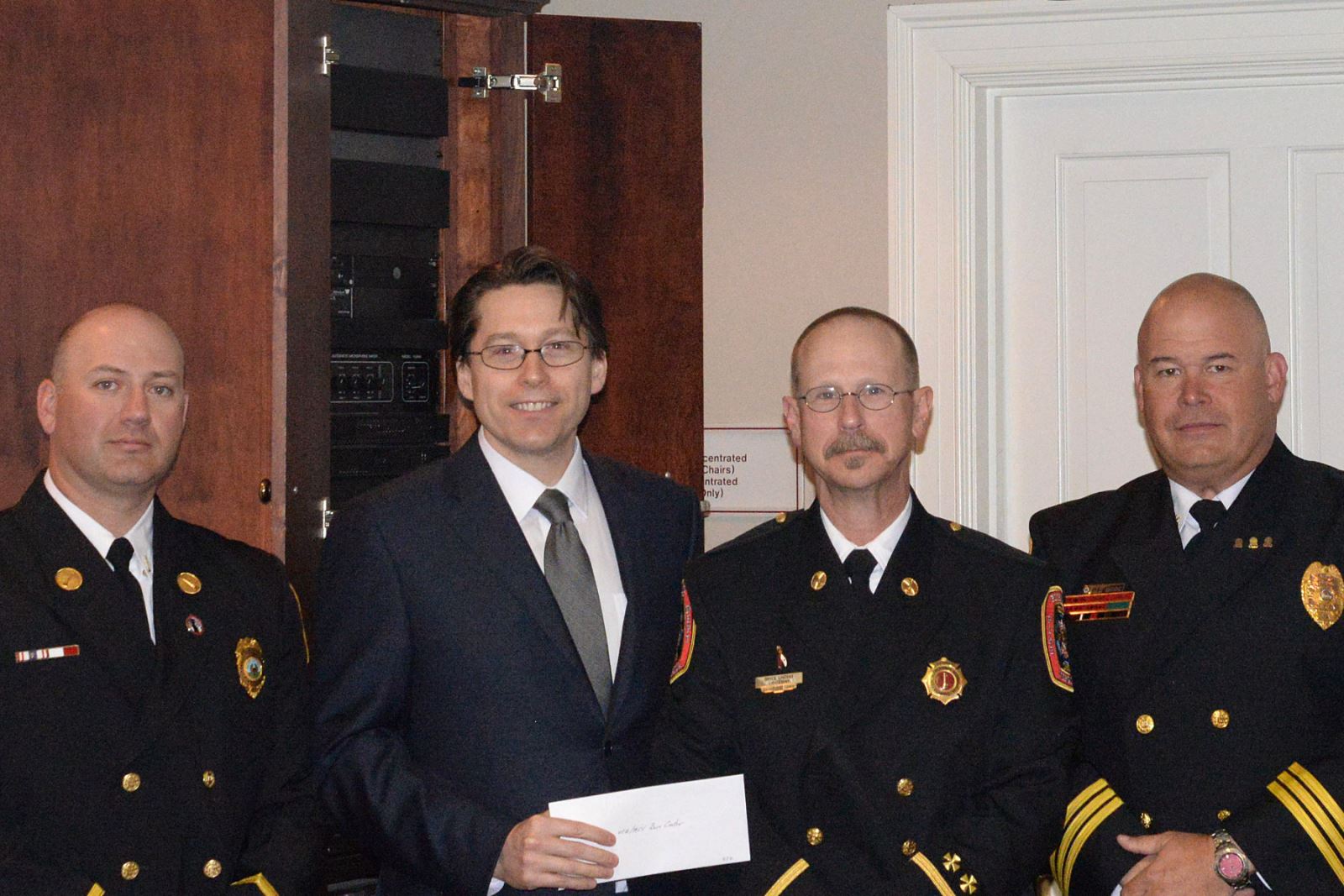 VCU Health Evans-Haynes Burn Center medical director Michael Feldman, M.D. (center) stands with Lt. Robert Drake of Hanover Fire and EMS, Lt. Bryce Lindsay, Richmond Fire and Emergency Services and Craig Bride, battalion chief of the Colonial Heights Fire Department.